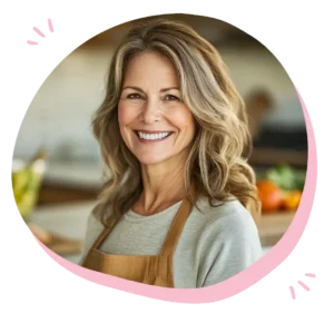 A warm and friendly woman in a cozy kitchen, smiling while preparing a delicious dish, embodying a passion for cuisine and home cooking. 
